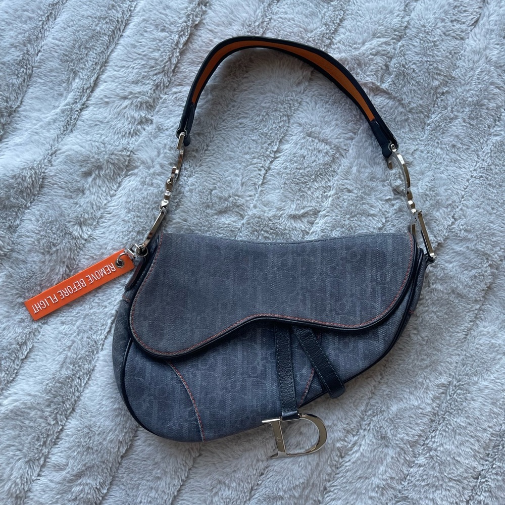 Dior, pre-owned vintage Trotter saddle bag. Farfetch picture for reference.